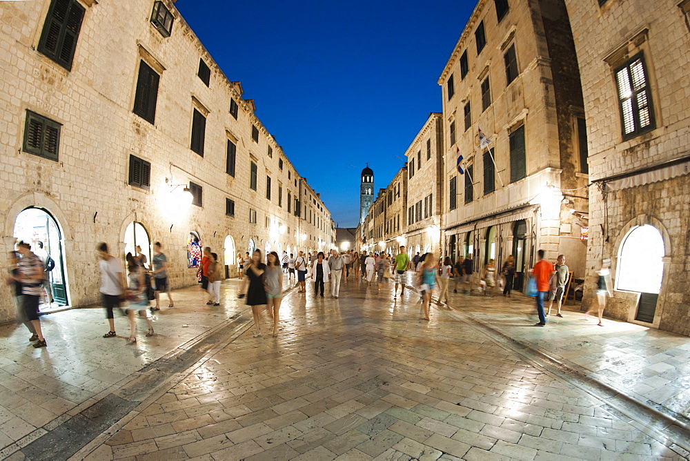 Pedestrians walking at night along Stradun, the main street in the old town in Dubrovnik, UNESCO World Heritage Site, Adriatic Coast, Croatia, Europe