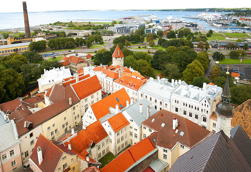 Rooftops of the old town in Tallinn, UNESCO World Heritage Site, with the port of Tallinn in the background, Estonia, Baltic States, Europe