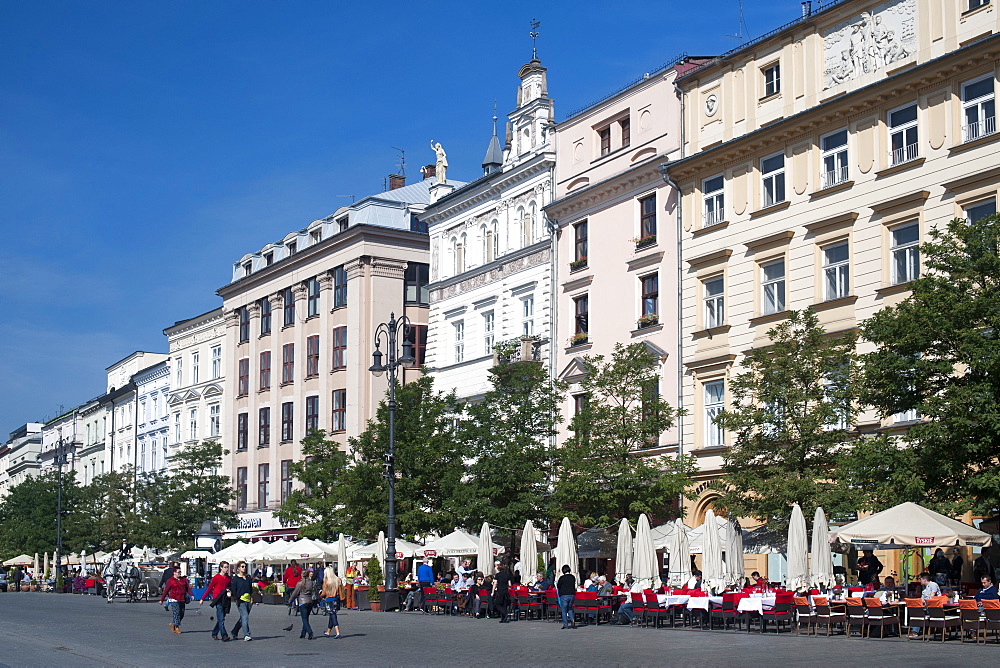 Buildings on Rynek Glowny, the main town square in Krakow in southern Poland, Europe