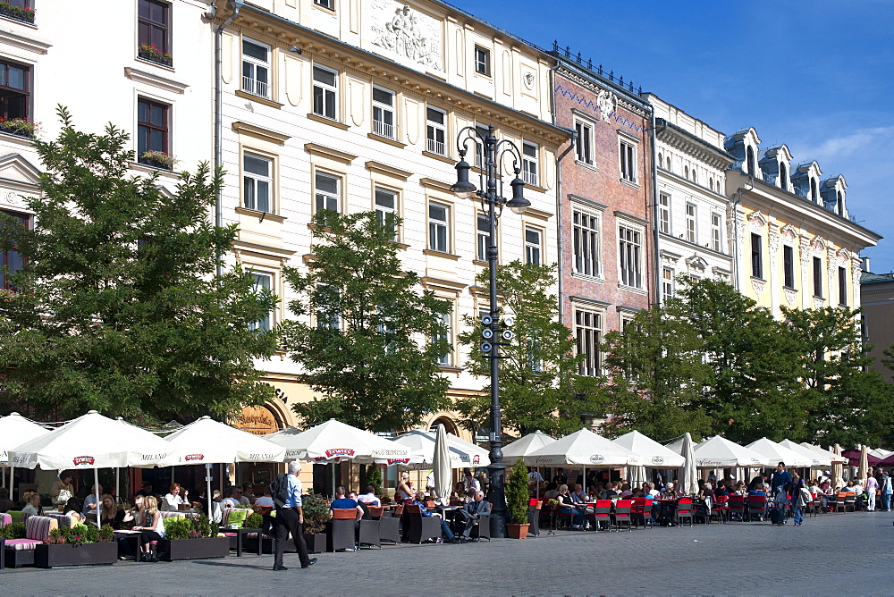 Buildings on Rynek Glowny, the main town square in Krakow in southern Poland, Europe