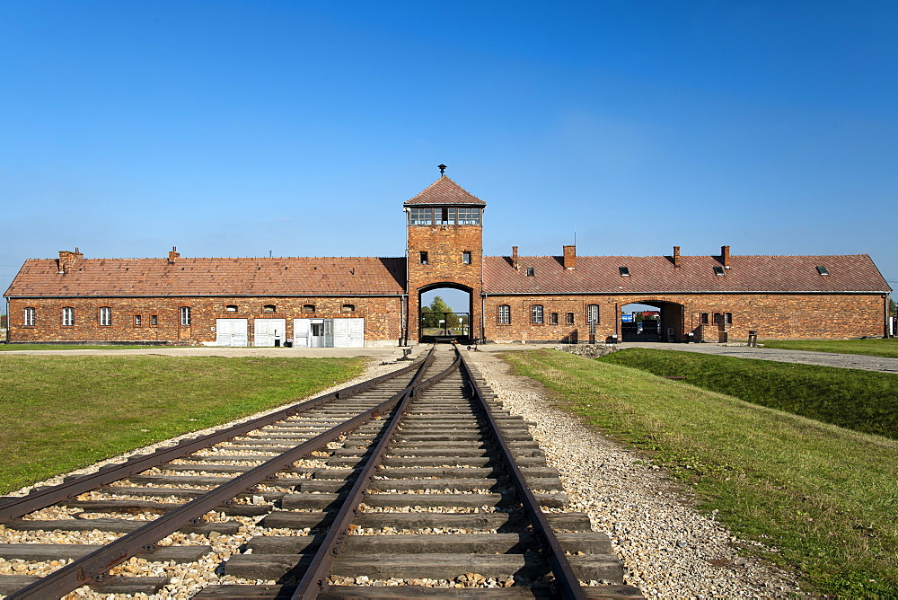 Entrance building and railway line of the former Auschwitz II-Birkenau concentration camp, UNESCO World Heritage Site, southern Poland, Europe