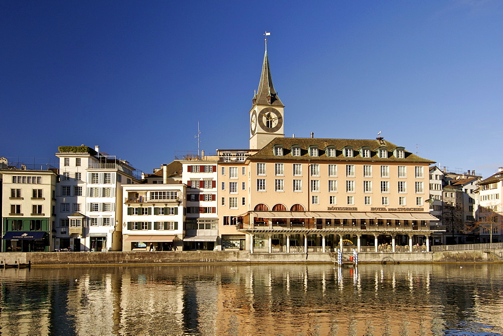 St Peter's church and buildings of the old town along the Limmat River in Zürich Switzerland.