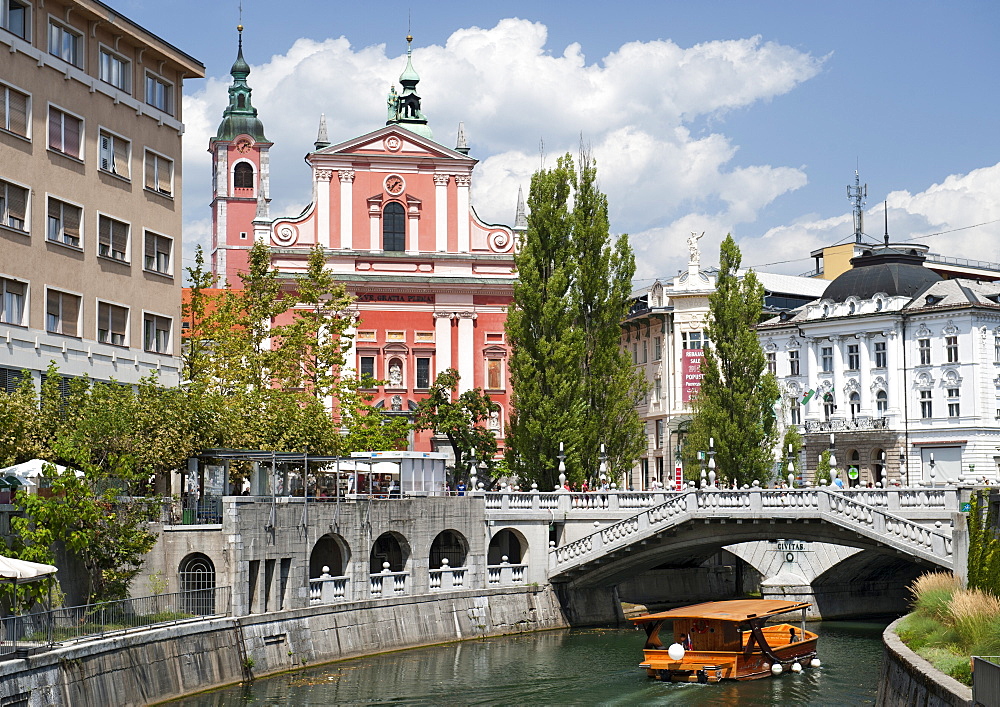 The Franciscan Church of the Annunciation and the Triple Bridge over the Ljubljanica River in Ljubljana, Slovenia, Europe