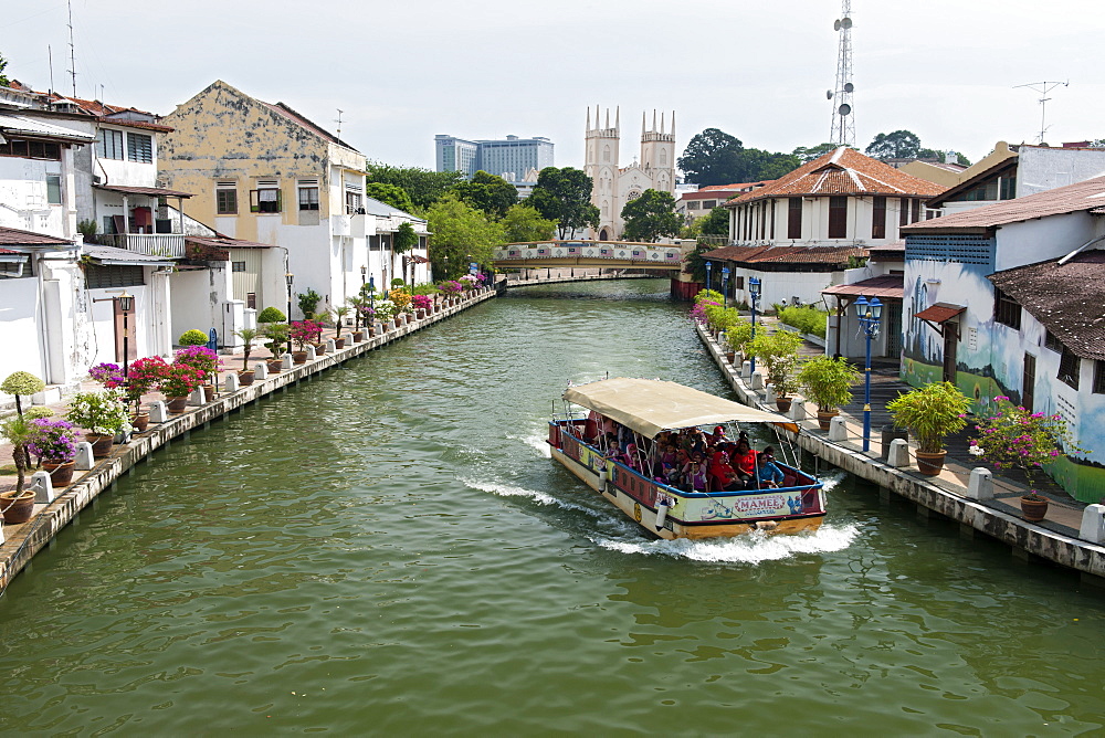 A boat on the Malacca River which flows through Malacca town, Malaysia.