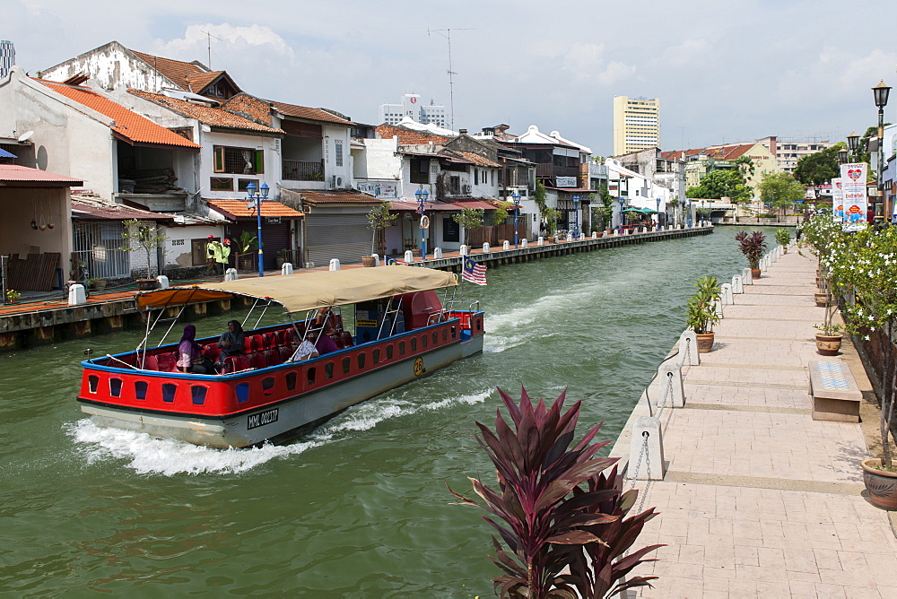 A boat on the Malacca River which flows through Malacca town, Malaysia.