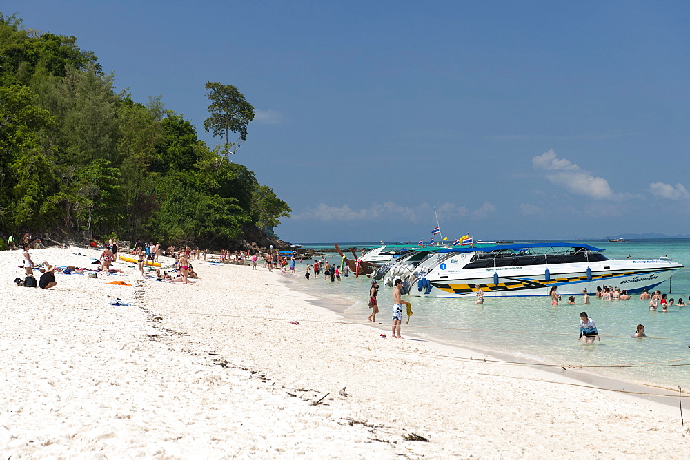 Tourists on Bamboo island (Ko Mai Phai) near Koh Phi Phi in the Andaman Sea on Thailand's west coast.