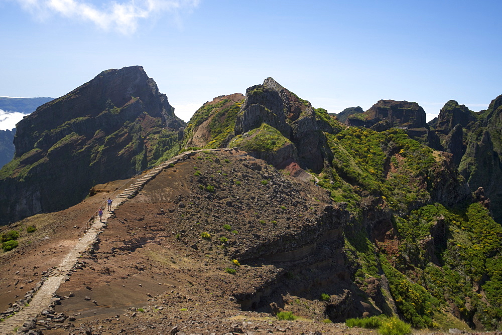 Hikers on the Pico de Areiero trail in Madeira. Pico de Areiero is the highest peak in Madeira at 1818 metres.