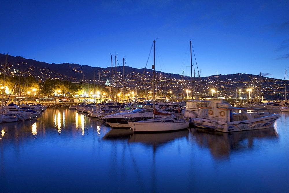 Boats in the Funchal marina in Madeira at dawn.