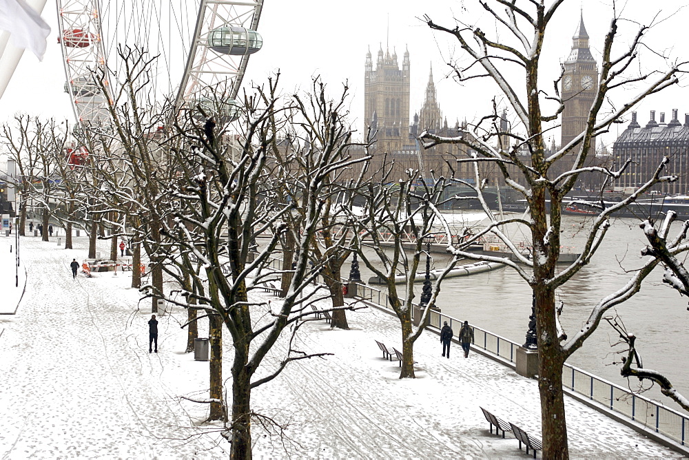 View of the Houses of parliament from the Thames river embankment in London after a snowfall.