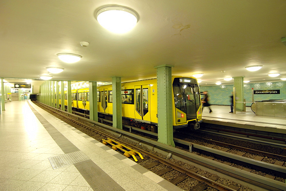 Yellow U-Bahn train at the Alexanderplatz station in East Berlin, Germany, Europe