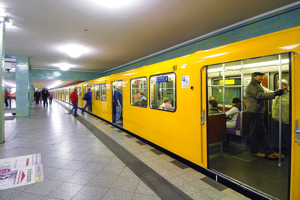 Yellow U-Bahn train at the Alexanderplatz station in East Berlin, Germany, Europe