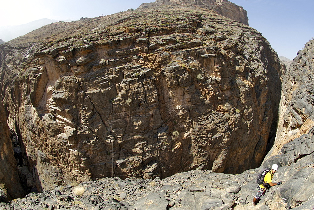 A hiker starting the Via Ferrata hike in Snake Canyon, part of Wadi Bani Auf in Jebel Akhdar of the western Hajar mountains in Oman.