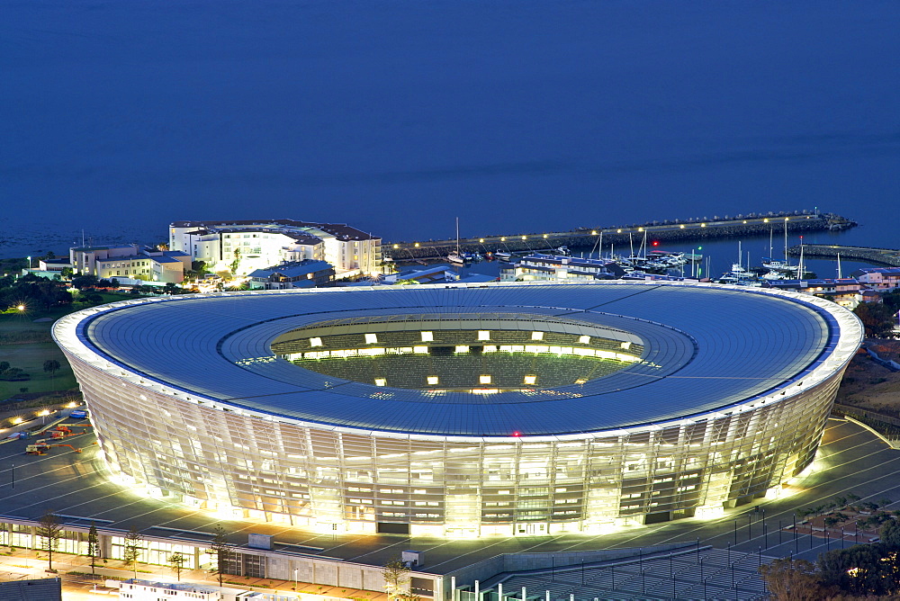 Dusk view of the new FIFA 2010 stadium in Greenpoint, Cape Town with Table Bay in the background.