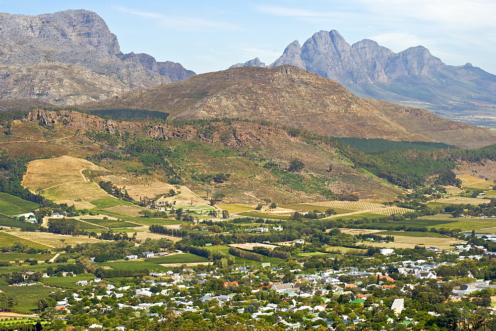 View across the vineyards and town of Franschhoek, Western Cape Province, South Africa.