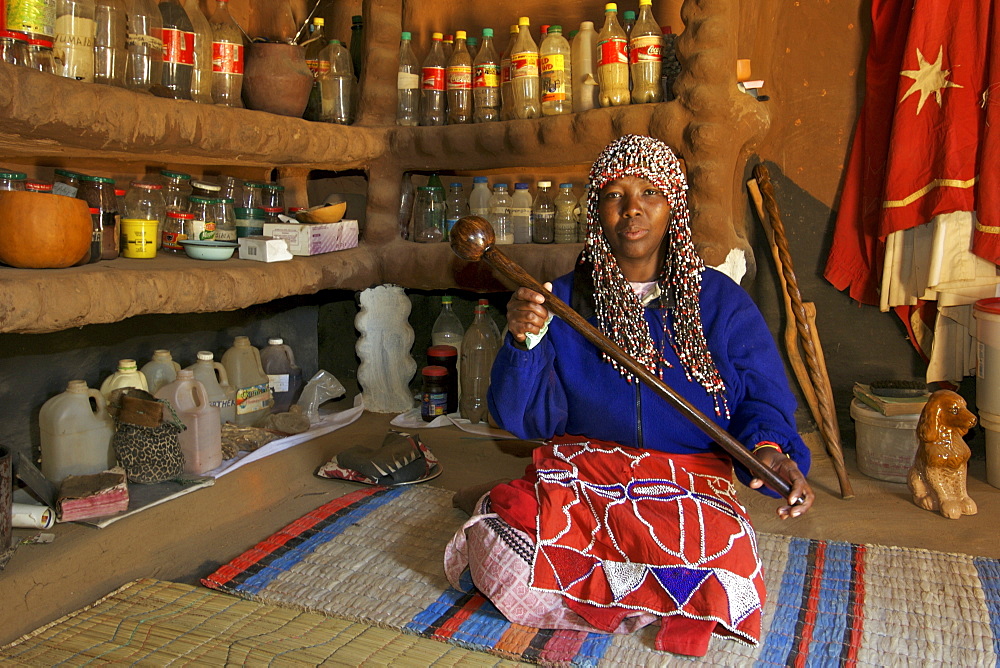 Aleta Thamae, a traditional sangoma posing in her consultation room in her house in the township of Refilwe near Cullinan in South Africa.