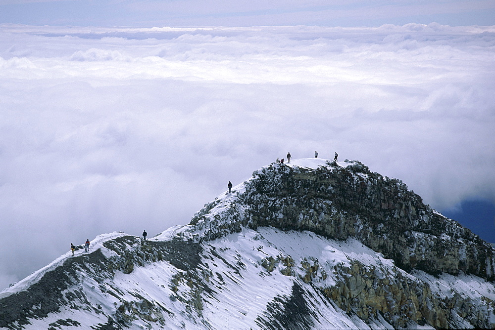 Hikers on Dome Ridge near the summit of 2797m Mount Ruapehu, highest and most active of the volcanoes in the National Park, Tongariro National Park, UNESCO World Heritage Site, central plateau, North Island, New Zealand, Pacific