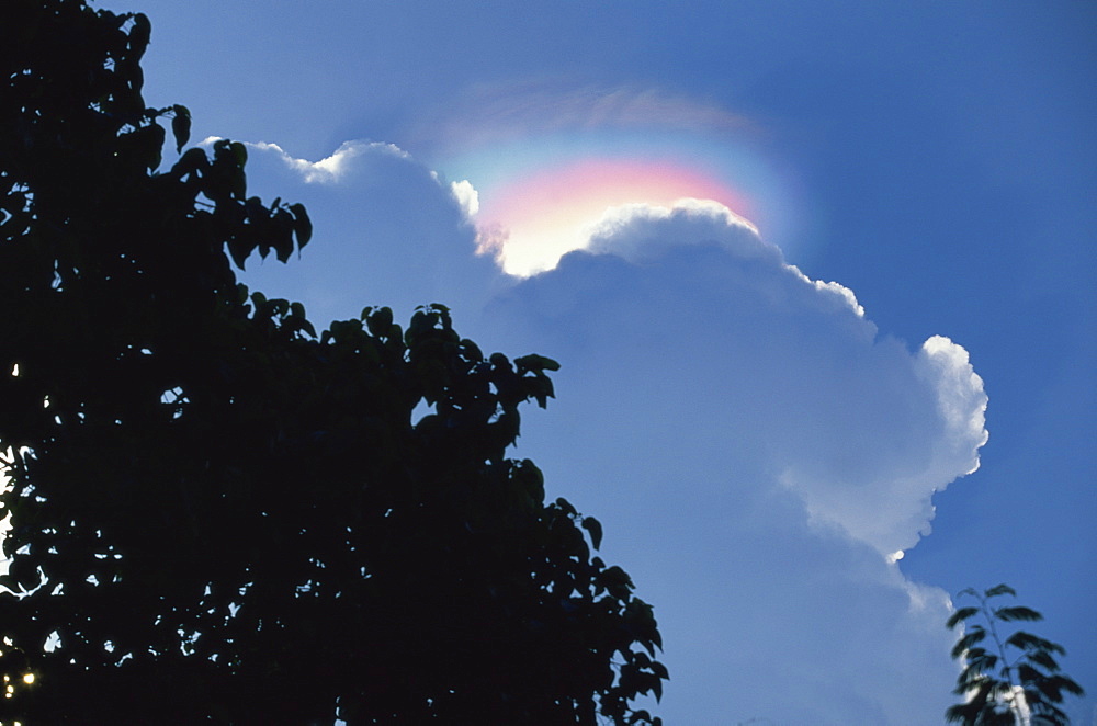 Rainbow atmospheric effect above cloud above the Ijen Plateau, Java, Indonesia, Southeast Asia, Asia