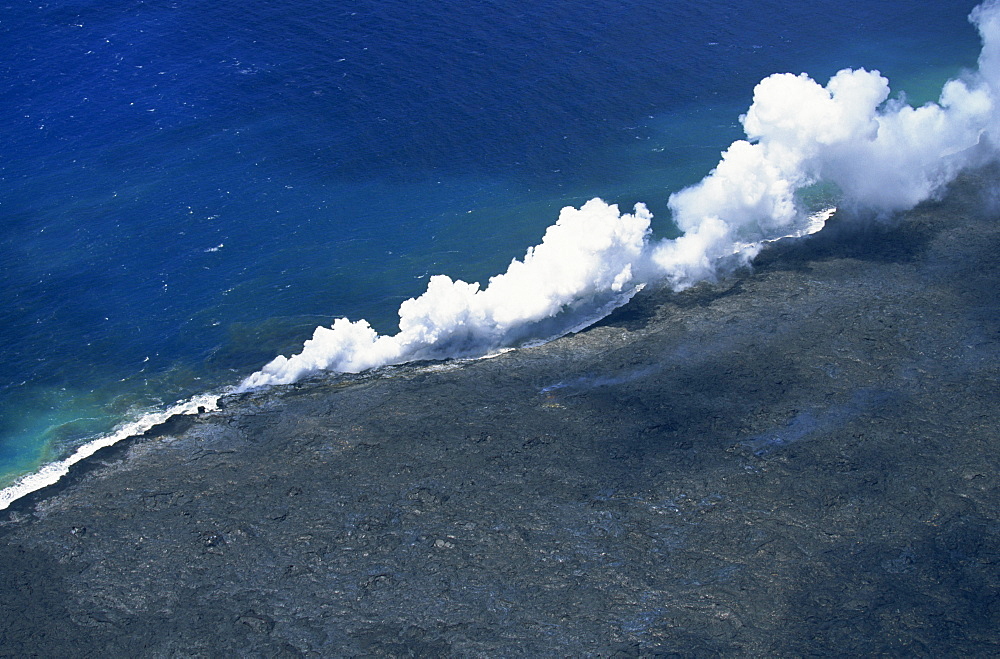 Steam cloud rising where lava from the Pu'u O'o cinder cone far inland enters sea on southeast Puna coast near Kaimu, Big Island, Hawaii, Hawaiian Islands, United States of America, Pacific, North America