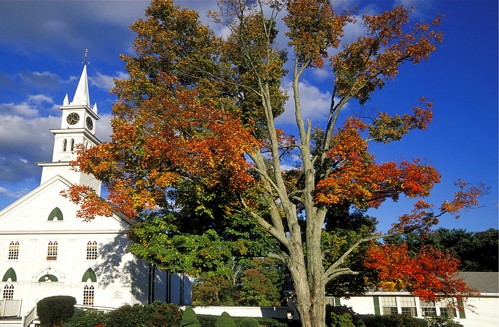 Church and autumn colours, part of the beautiful New England fall display, at a small town west of Boston, Massachusetts, USA