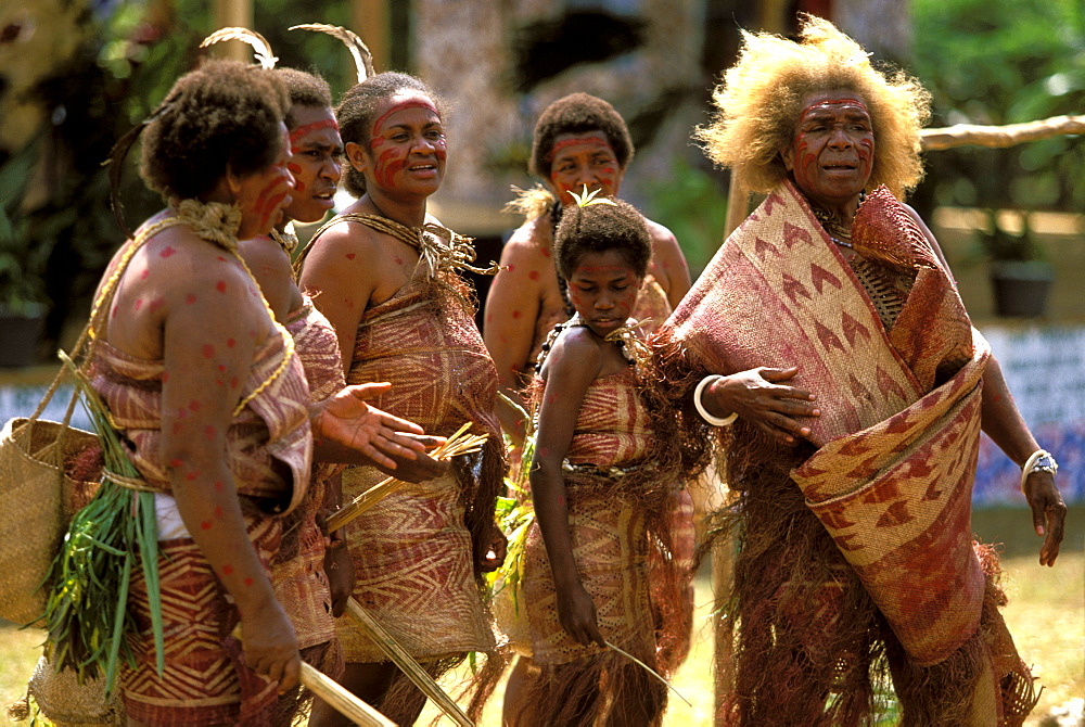 Women from the island of Pentecost in a traditional dance at a Melanesian cultural festival. The fair haired one has a common genetic mutation, Efate Island, Port Vila, Vanuatu