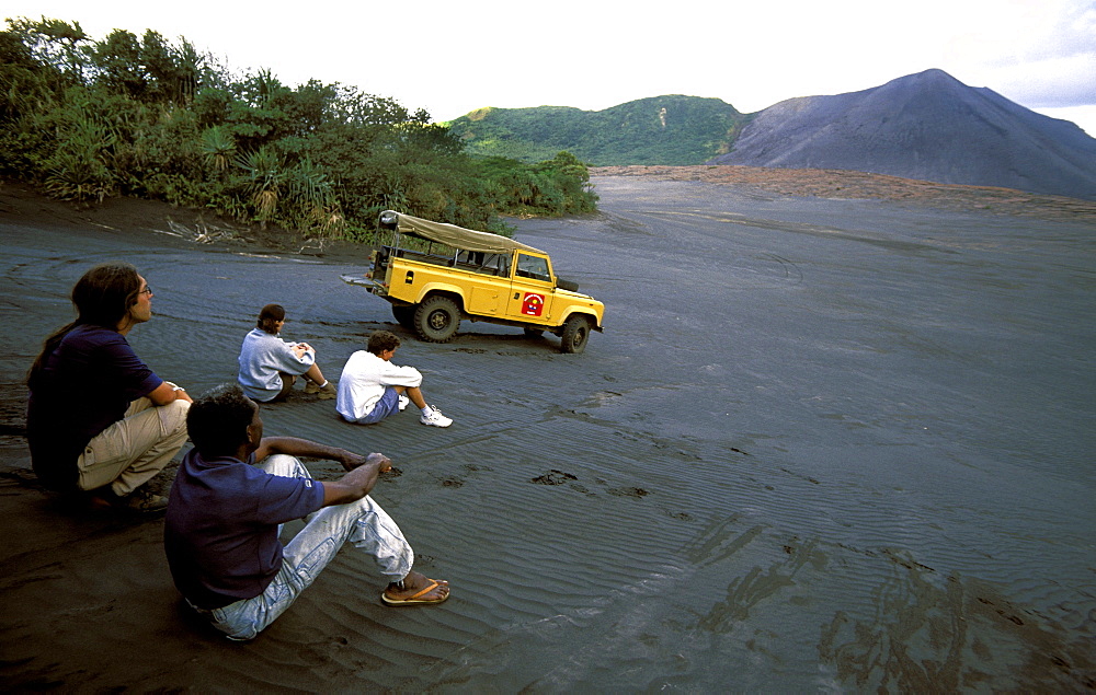 Tourists on the ash plain of Mt Yasur in east Tanna, one of the Pacific's most accessible & active volcanoes, Tanna Island, Yasur Volcano, Vanuatu