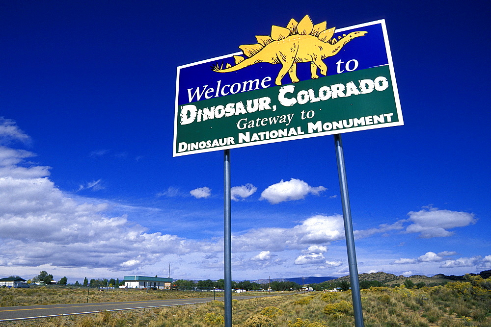 Sign for the town of Dinosaur in the far north west. Previously called Artesia, it was renamed in 1965 to capitalize on it's proximity to Dinosaur National Monument, North West, Colorado, USA