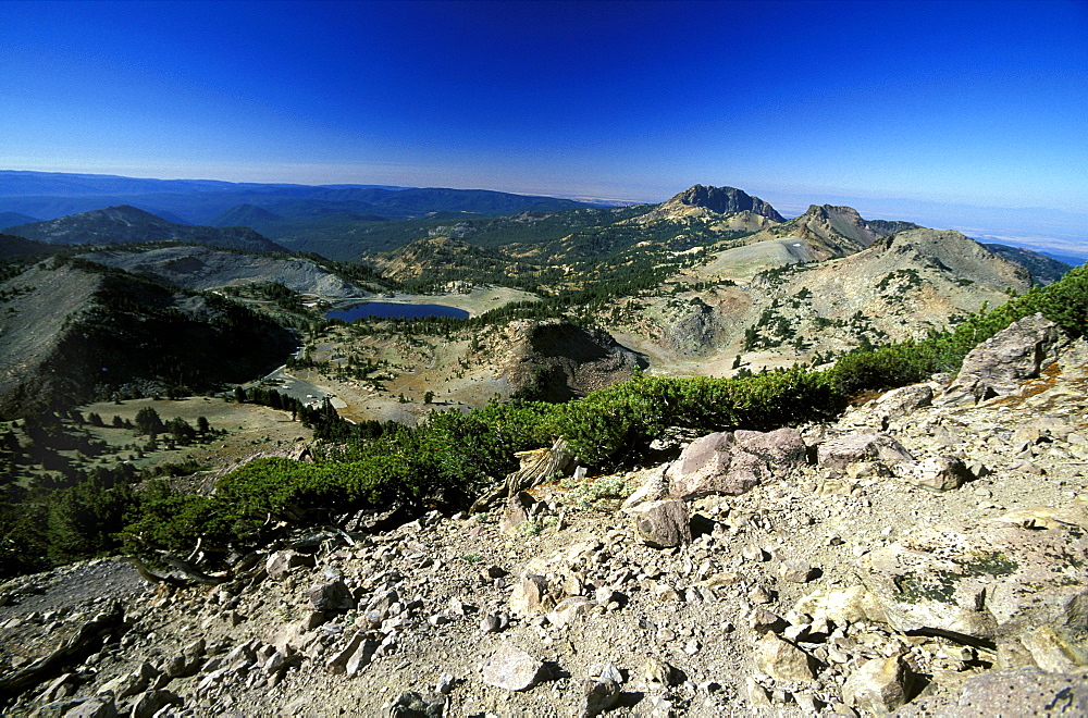 Looking south towards Lake Helen from dormant 10,457ft Lassen Peak, the world's largest plug-dome volcano, in Lassen Volcanic National Park, an area of volcanic activities and features, Lassen Volcanic Park, Northern California, California, United States of America (USA), North America