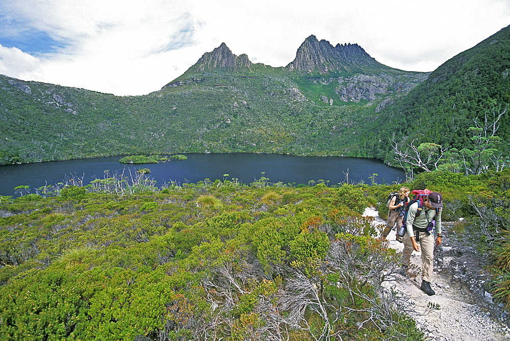 Hikers at Dove Lake below 1545m Cradle Mountain in the 'World Heritage' Cradle Mountain-Lake St. Clair National Park, Tasmania, Australia, Pacific