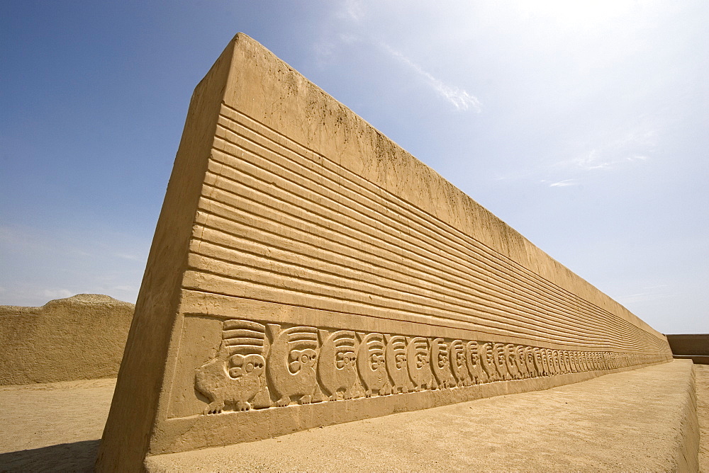 Restored wall with mythical bird motif in the Tschudi Complex, one of the ten 'ciudadelas' at Chan Chan,  pre-Columbian America's largest adobe city and capital of the Chimu Empire until its 14th century conquest by the Incas, Chan Chan, UNESCO World Heritage Site, Moche Valley, Trujillo, Peru, South America