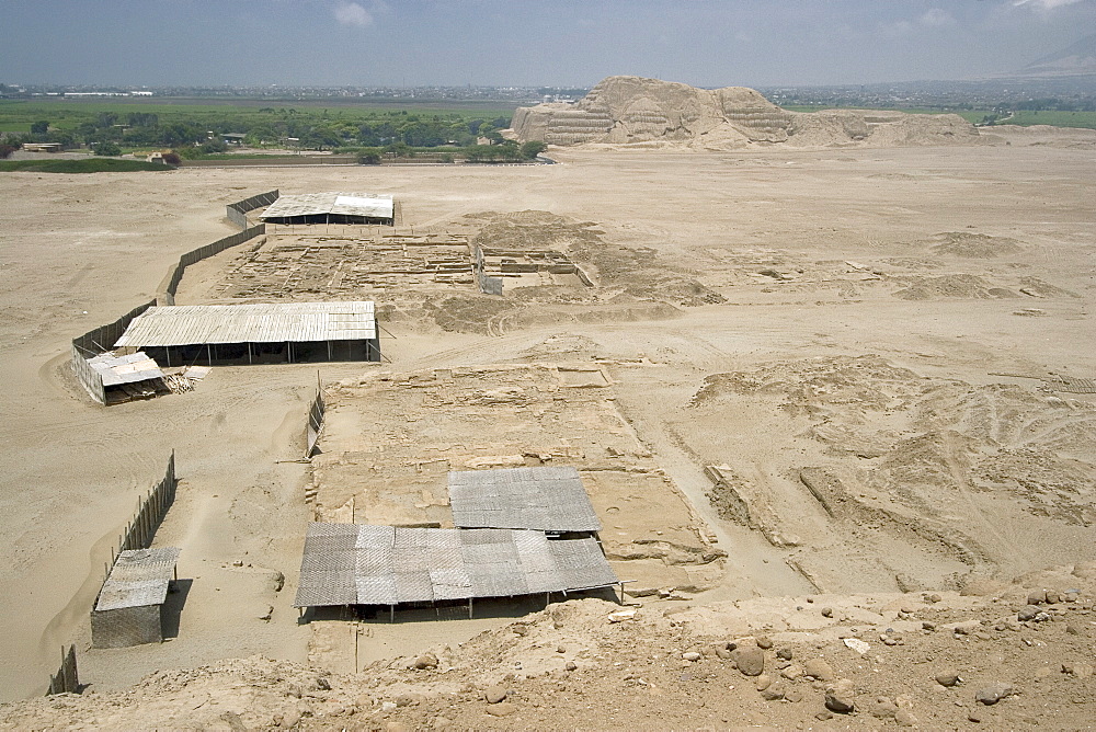 Looking from the Huaca de la Luna towards the Huaca del Sol - another adobe brick temple pyramid of the Moche people (100BC-AD850) and probably the largest adobe structure in pre-Columbian America, Huaca del Sol, Trujillo, Peru, South America