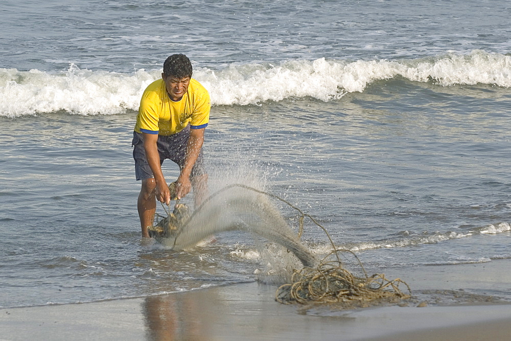 Fisherman on the beach at the popular far north coast fishing & surfing village of Huanchaco, near Trujillo, Peru, South America.