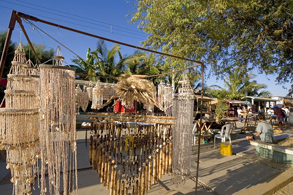 Street stalls selling souvenirs and jewellery on the Pan-American Highway and main street at this surfing resort in the far north near the Ecuadorean border, Mancora, Peru, South America