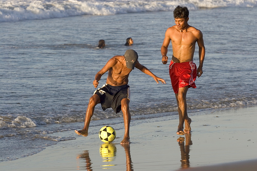 Football on the beach at this popular surfing resort in the far north near the Ecuadorean border, Mancora, Peru, South America