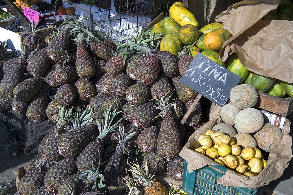 Pineapples, papaya, melons, and passionfruit at the market of this vibrant commercial and historic centre in the north, Puira, Peru, South America