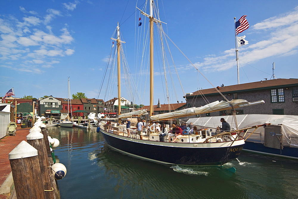 The 80 foot excursion schooner Aquidneck returning to Bowen's Wharf, established in 1760 and now a busy waterfront retail and tourist centre, Newport, Rhode Island, New England, United States of America, North America