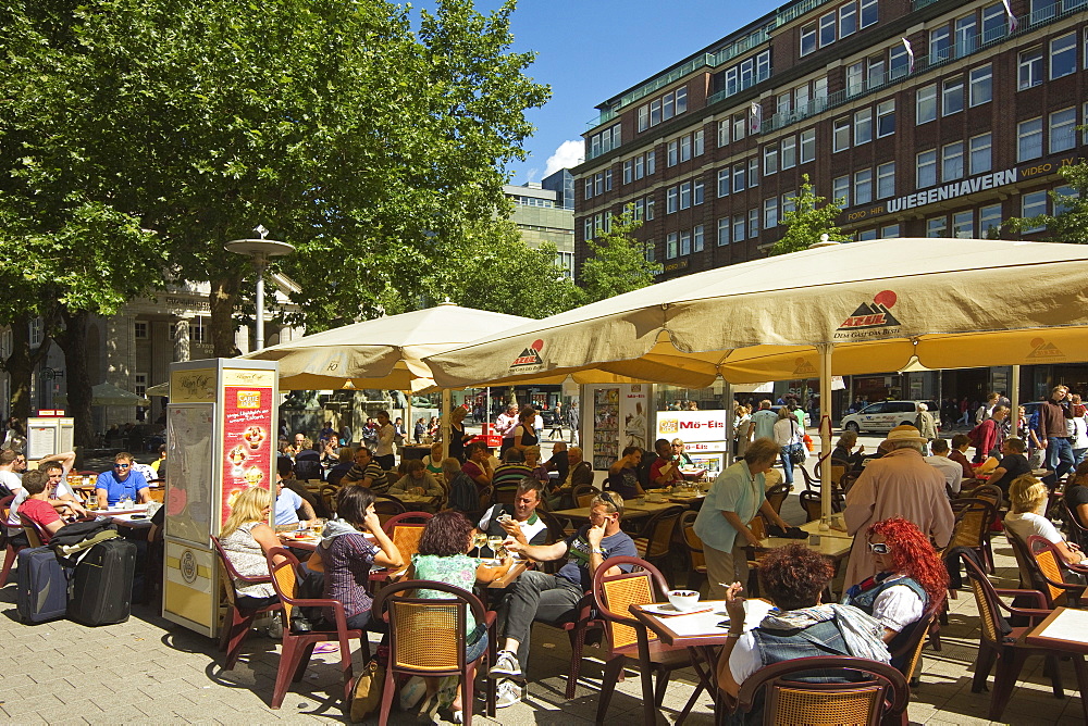 People sitting al fresco at cafe with parasols on Moenckebergstrasse in the shopping heart of the city centre, Hamburg, Germany, Europe