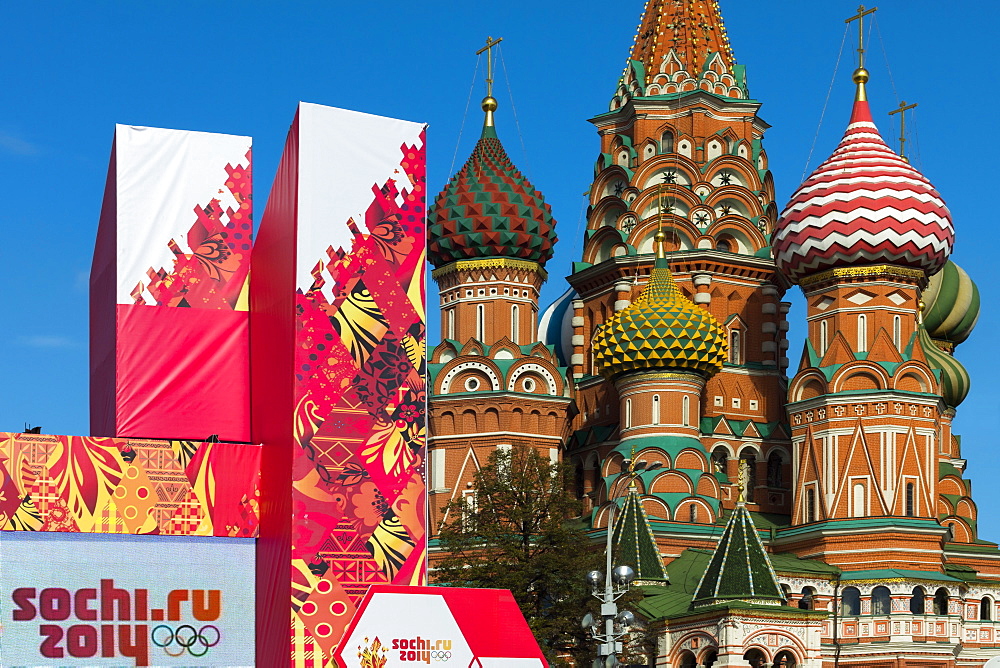 Torch Relay stand for Sochi Winter Olympics 2014, with onion domes of St. Basil's Cathedral beyond, Red Square, Moscow, Russia, Europe