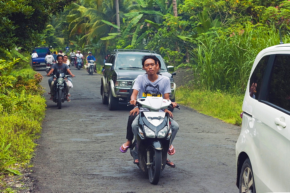 Busy traffic, typical of Java's now clogged roads, near the south coast resort town of Pangandaran, West Java, Java, Indonesia, Southeast Asia, Asia