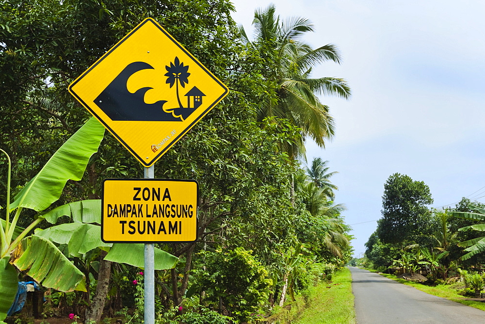 Tsunami zone warning sign on the south coast road near Cikalong, West Java, Java, Indonesia, Southeast Asia, Asia