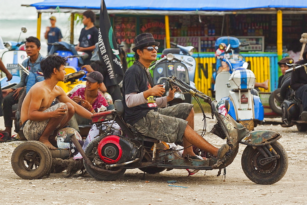 Young men at scooter enthusiasts' meet on the seafront of this major south coast resort, Pangandaran, West Java, Java, Indonesia, Southeast Asia, Asia