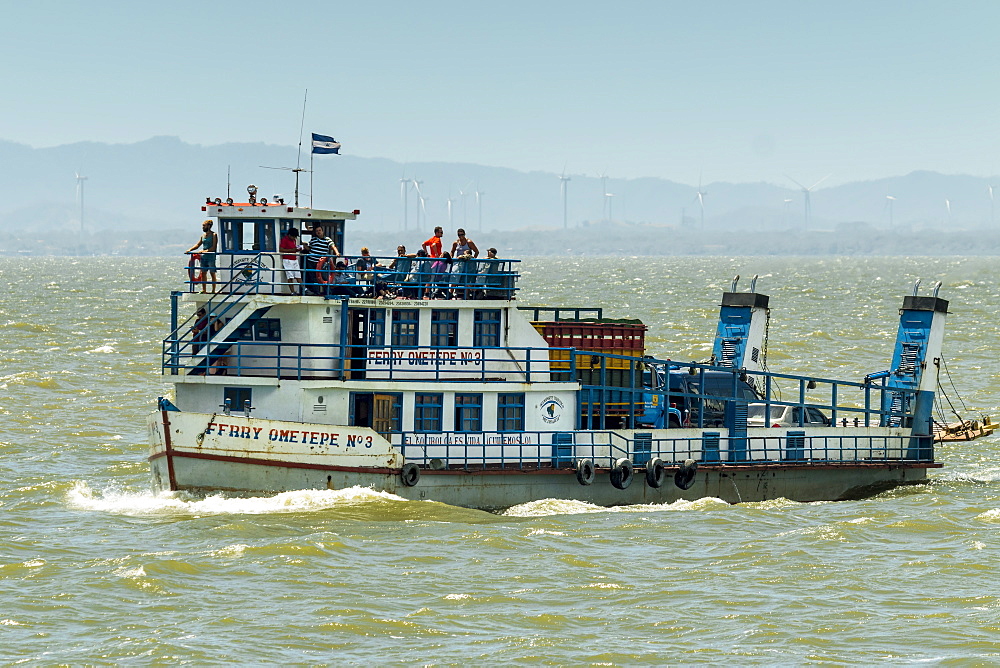 Ferry heading from San Jorge to Omotepe Island, carrying tourists, locals and  freight, Isla Omotepe, Lake Nicaragua, Nicaragua, Central America