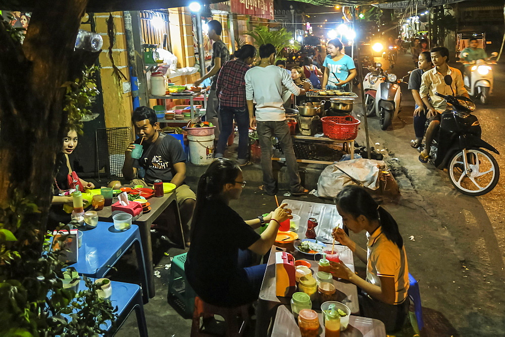 People eating street food at stalls near the riverfront,city centre, Phnom Penh, Cambodia, Indochina, Southeast Asia, Asia