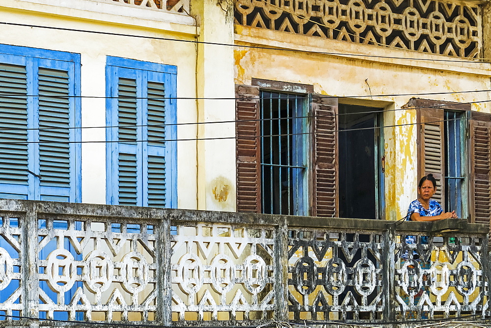 Faded balconies and shutters on a street in this old formerly French colonial river port, Kampot, Kampot Province, Cambodia, Indochina, Southeast Asia, Asia