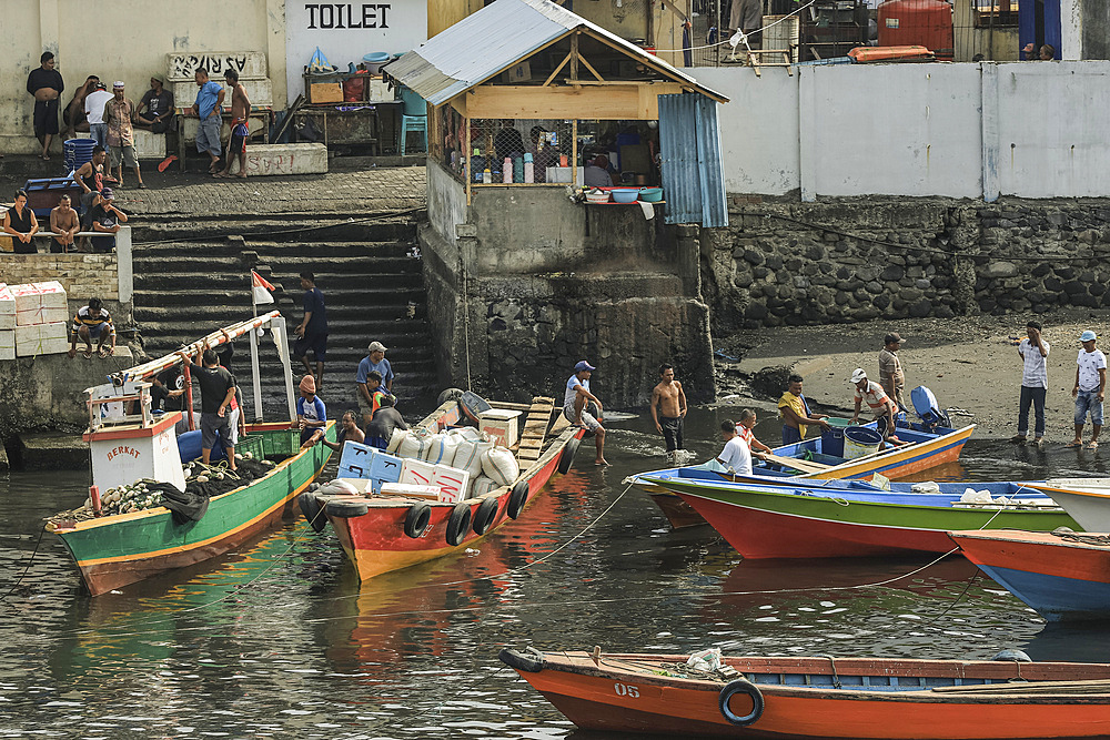 Colourful wooden ferry boats on the waterfront in the port of this provincial capital in Sulawesi's far north, Manado, North Sulawesi, Indonesia, Southeast Asia, Asia