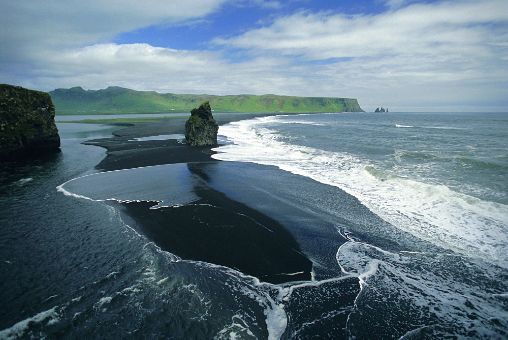 Black volcanic sand and sea stack at south coast bird sanctuary, Dyrholaey, Iceland, Polar Regions