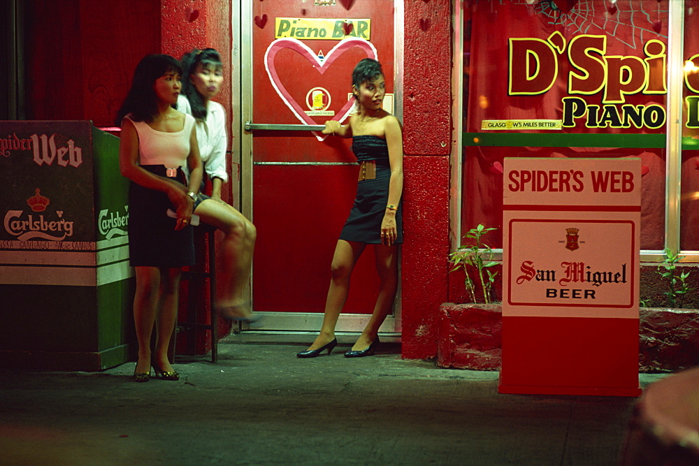 Doorgirls at nightclub entrance in hotel and nightclub district of Ermita, Manila, Philippines, Southeast Asia, Asia