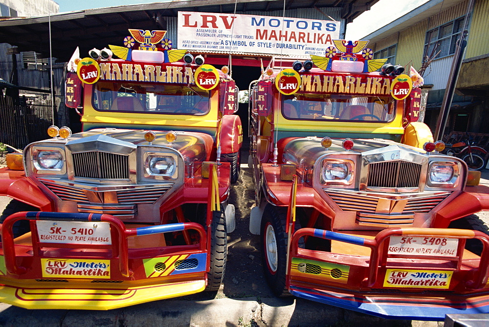 Pair of customised Jeepney trucks, the ubiquitous national transport, Bacolod City, Philippines, Southeast Asia, Asia