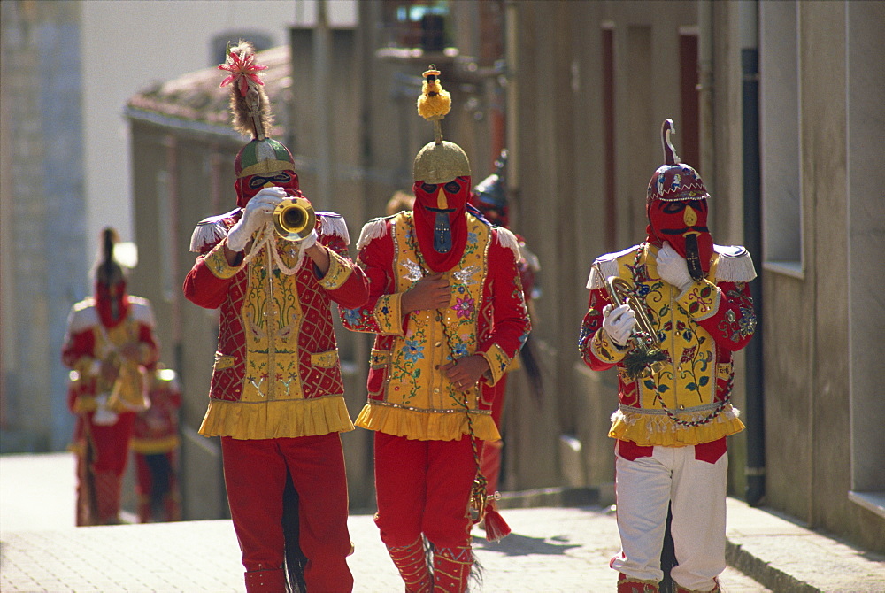 Trumpet players in red costumes and horse tails celebrate the Feast of the Jews, just before Easter, in the Lombard village of San Fratello, north Sicily, Italy, Europe