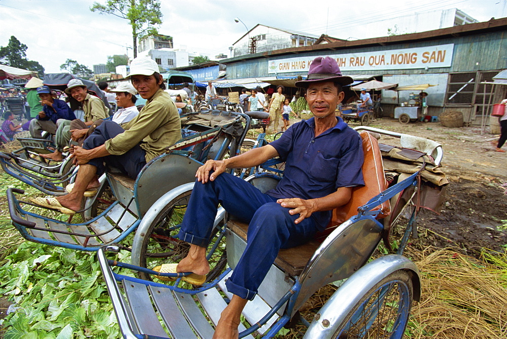 Cyclo drivers at a market in central Ho Chi Minh City (formerly Saigon), waiting for business, Vietnam, Indochina, Southeast Asia, Asia