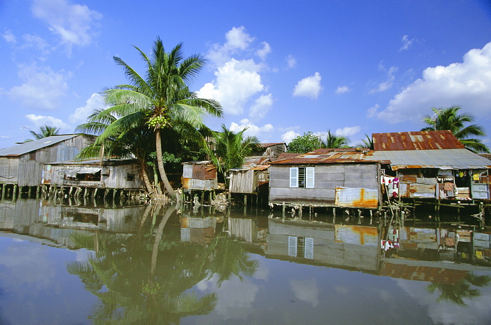 Houses on stilts on the Rach Thi Nghe, backwater of the Saigon River, Ho Chi Minh City (formerly Saigon), Vietnam, Indochina, Southeast Asia, Asia